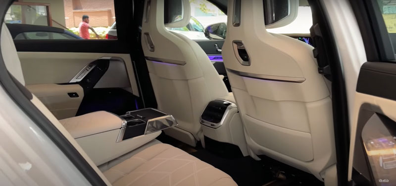 The rear-interior view of a BMW i7.