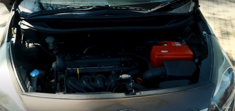 The engine compartment of the 2015 sedan model Kia Rio