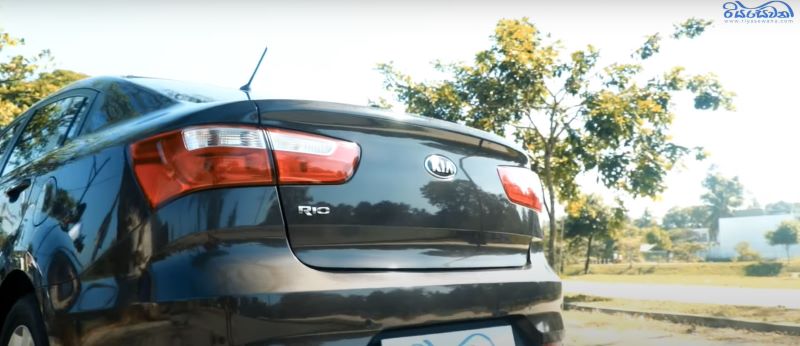 The rear exterior view of the 2015 sedan model Kia Rio