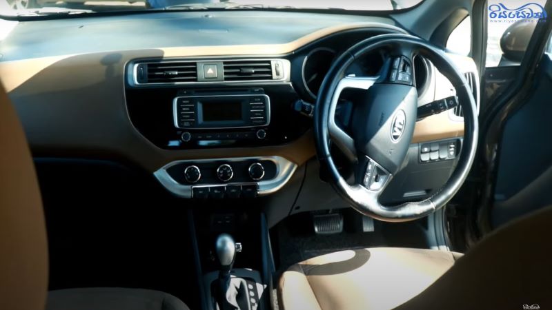 The front-interior view of the 2015 sedan model Kia Rio