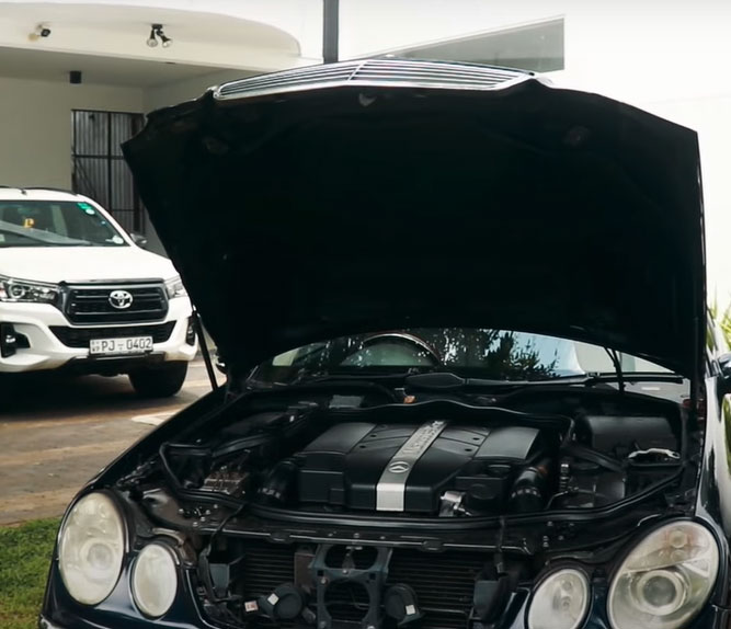 The engine compartment of the Benz E240