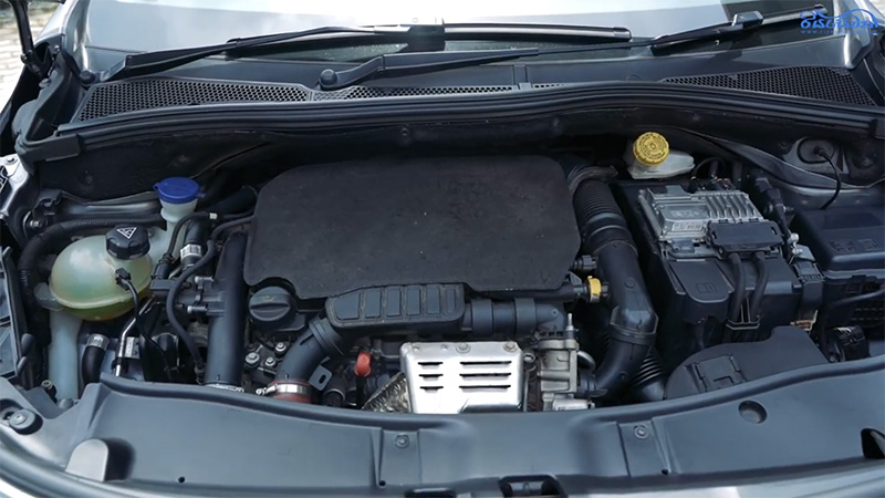 The engine compartment of a 1.2-liter, PureTech inline 3-cylinder Peugeot 2008 SUV