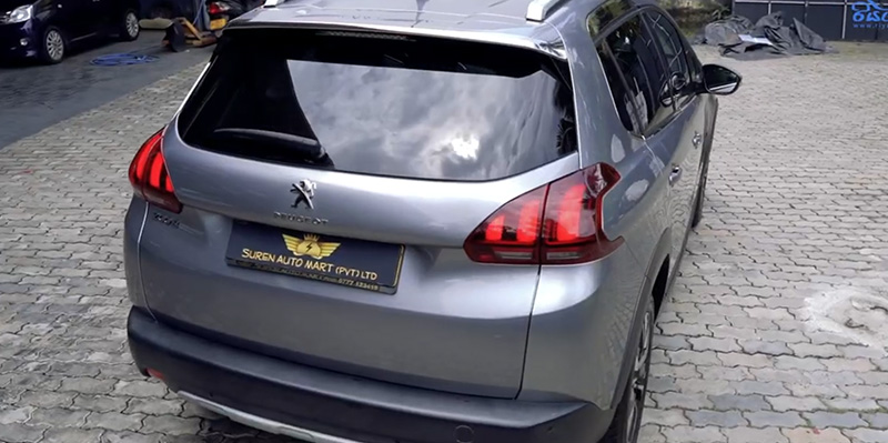 The rear exterior view of the Peugeot 2008 first generation SUV