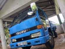 https://riyasewana.com/uploads/isuzu-elf-150-1981-67232312072.jpg