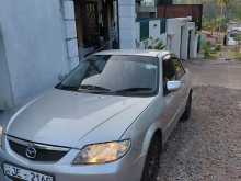 Mazda Familia BJ5 Prado Light 2001 Car