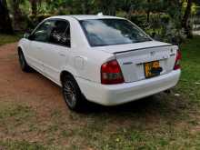 https://riyasewana.com/uploads/mazda-familia-bj5p-2000-717295812413.jpg