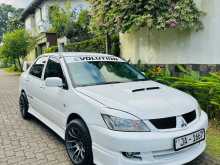 https://riyasewana.com/uploads/mitsubishi-lancer-cs1-2004-99535912812.jpg