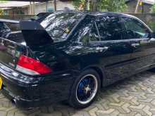 https://riyasewana.com/uploads/mitsubishi-lancer-cs5-2006-2213372112764.jpg